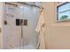 Luxurious bathroom with a glass-enclosed shower with marble tile and gold hardware at 5720 E Caley Ave, Centennial, CO 80111