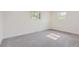 Bright bedroom with neutral carpet, white walls, and natural light at 5720 E Caley Ave, Centennial, CO 80111