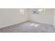 Cozy bedroom with neutral carpet, white walls, and natural light at 5720 E Caley Ave, Centennial, CO 80111