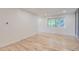 Bright bedroom with hardwood floors and large window allowing plenty of natural light to filter in at 5720 E Caley Ave, Centennial, CO 80111