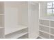 Bright walk-in closet with custom shelving provides ample storage and organization space at 5720 E Caley Ave, Centennial, CO 80111