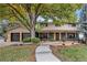 Inviting two-story home boasting a charming front yard, a large shade tree and a two car garage at 5720 E Caley Ave, Centennial, CO 80111