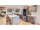 Modern kitchen featuring stainless steel appliances, quartz countertops, and a stylish center island at 5720 E Caley Ave, Centennial, CO 80111