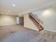 Carpeted basement featuring stairs to the first floor at 11197 W 64Th Pl, Arvada, CO 80004