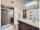 Bathroom features a glass shower and a double vanity sink at 11197 W 64Th Pl, Arvada, CO 80004