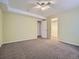 Bedroom featuring carpeted floors, a ceiling fan, and a double door closet at 11197 W 64Th Pl, Arvada, CO 80004