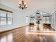 Spacious living room with vaulted ceiling, fireplace, and oak flooring at 11197 W 64Th Pl, Arvada, CO 80004