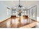 Bright living room featuring vaulted ceilings, a stone fireplace, and large windows at 11197 W 64Th Pl, Arvada, CO 80004