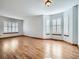 Sun-drenched living room featuring oak floors, pristine walls, and natural light at 11197 W 64Th Pl, Arvada, CO 80004