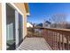 Spacious balcony with wood railings, offering scenic neighborhood views at 317 Pheasant Run, Louisville, CO 80027