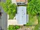 Aerial view of the house with a gray roof and well manicured lawn at 6943 Ingalls St, Arvada, CO 80003