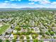 A nice aerial view of the neighborhood with tree lined streets and mountain views in the distance at 6943 Ingalls St, Arvada, CO 80003