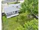 Aerial view of backyard, deck and mature trees at 6943 Ingalls St, Arvada, CO 80003