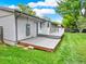 A backyard with a gray deck at 6943 Ingalls St, Arvada, CO 80003
