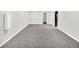 A spacious unfinished basement with neutral carpet offers potential for customization and expansion at 6943 Ingalls St, Arvada, CO 80003
