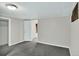 Finished basement space features carpeting, closet, and access to utilities at 6943 Ingalls St, Arvada, CO 80003