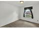 Neutral bedroom with tan carpet features a window providing natural light at 6943 Ingalls St, Arvada, CO 80003