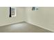This bedroom is carpeted with two windows and neutral walls at 6943 Ingalls St, Arvada, CO 80003