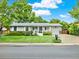 Charming single-story home featuring a well-manicured lawn and attached one car garage at 6943 Ingalls St, Arvada, CO 80003