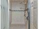 A tiled shower stall with a bench seat at 6943 Ingalls St, Arvada, CO 80003