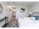 Comfortable bedroom with stylish decor, a queen bed, and natural light at 1221 Illinois St # 2E, Golden, CO 80401