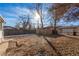 Backyard featuring a mix of bare ground and fallen leaves under the trees, with fencing at 367 S Jasmine St, Denver, CO 80224