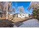 Backyard featuring a mix of bare ground, grass and fallen leaves with fencing at 367 S Jasmine St, Denver, CO 80224