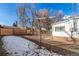 Backyard featuring a mix of bare ground, grass and fallen leaves with fencing at 367 S Jasmine St, Denver, CO 80224