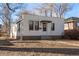 A single-story home with horizontal siding and a small front yard covered in fallen leaves at 367 S Jasmine St, Denver, CO 80224