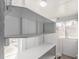 White storage space with shelves and a window at 367 S Jasmine St, Denver, CO 80224