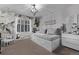 Charming bedroom featuring a swing chair, floral wallpaper, and a cozy bed for ultimate relaxation at 10262 S Royal Eagle Ln, Highlands Ranch, CO 80129