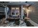 Inviting front porch featuring stone accents, seating, and a welcoming entrance to the home at 10262 S Royal Eagle Ln, Highlands Ranch, CO 80129