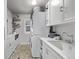 Charming laundry room with stacked washer and dryer and ample counter space at 10262 S Royal Eagle Ln, Highlands Ranch, CO 80129