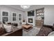 Inviting living room showcasing a fireplace, built-in shelves, and comfortable seating at 10262 S Royal Eagle Ln, Highlands Ranch, CO 80129