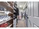 Well-organized walk-in closet with built-in shelves and ample storage space at 10262 S Royal Eagle Ln, Highlands Ranch, CO 80129