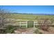 Backyard with a white fence, gate and view of mountains in the distance at 10751 Manorstone Dr, Highlands Ranch, CO 80126