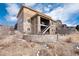 Home's exterior showcases a stone retaining wall and lush landscaping at 10751 Manorstone Dr, Highlands Ranch, CO 80126