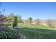 Tranquil backyard with manicured lawn and lush landscaping at 10751 Manorstone Dr, Highlands Ranch, CO 80126