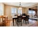 Cozy dining area with natural light and sliding glass doors leads to an outdoor living space at 10751 Manorstone Dr, Highlands Ranch, CO 80126