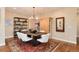 Charming dining room features a rustic wood table, decorative rug, and stylish accent furniture at 10751 Manorstone Dr, Highlands Ranch, CO 80126