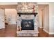 Cozy fireplace with stone surround and mantel at 10751 Manorstone Dr, Highlands Ranch, CO 80126