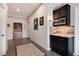 Inviting hallway with decorative storage and a convenient kitchenette area at 10751 Manorstone Dr, Highlands Ranch, CO 80126