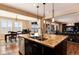 Bright kitchen island offers ample counter space with an open view of the dining and living areas at 10751 Manorstone Dr, Highlands Ranch, CO 80126