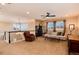 Upstairs living room featuring neutral walls, carpeted floors, comfortable seating, and an abundance of light at 10751 Manorstone Dr, Highlands Ranch, CO 80126