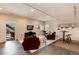 Open-plan living room with outside access, kitchenette and comfortable seating at 10751 Manorstone Dr, Highlands Ranch, CO 80126