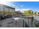 Stone patio overlooking a pond, equipped with stylish outdoor seating, offering serene outdoor relaxation at 10751 Manorstone Dr, Highlands Ranch, CO 80126