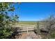 Scenic view of a sprawling field, fence, mountains, and clear blue sky at 10751 Manorstone Dr, Highlands Ranch, CO 80126