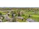 Impressive aerial view of home nestled among trees near golf course and local amenities at 21 Fairway Ln, Littleton, CO 80123