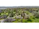 Overhead view of a neighborhood and golf course, nestled among mature trees at 21 Fairway Ln, Littleton, CO 80123