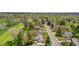 Charming aerial view of a neighborhood with tree-lined streets and golf course at 21 Fairway Ln, Littleton, CO 80123